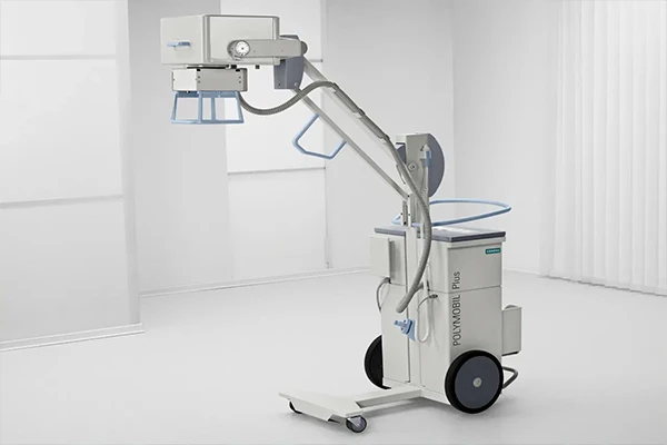 A portable x-ray machine at a patient's bedside